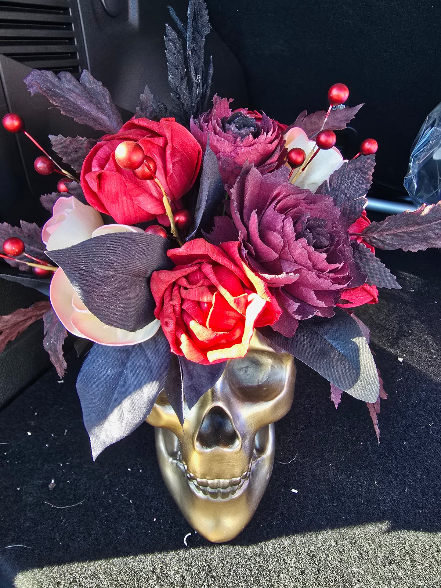 Gold Skull with Red, Black, and Champagne Roses