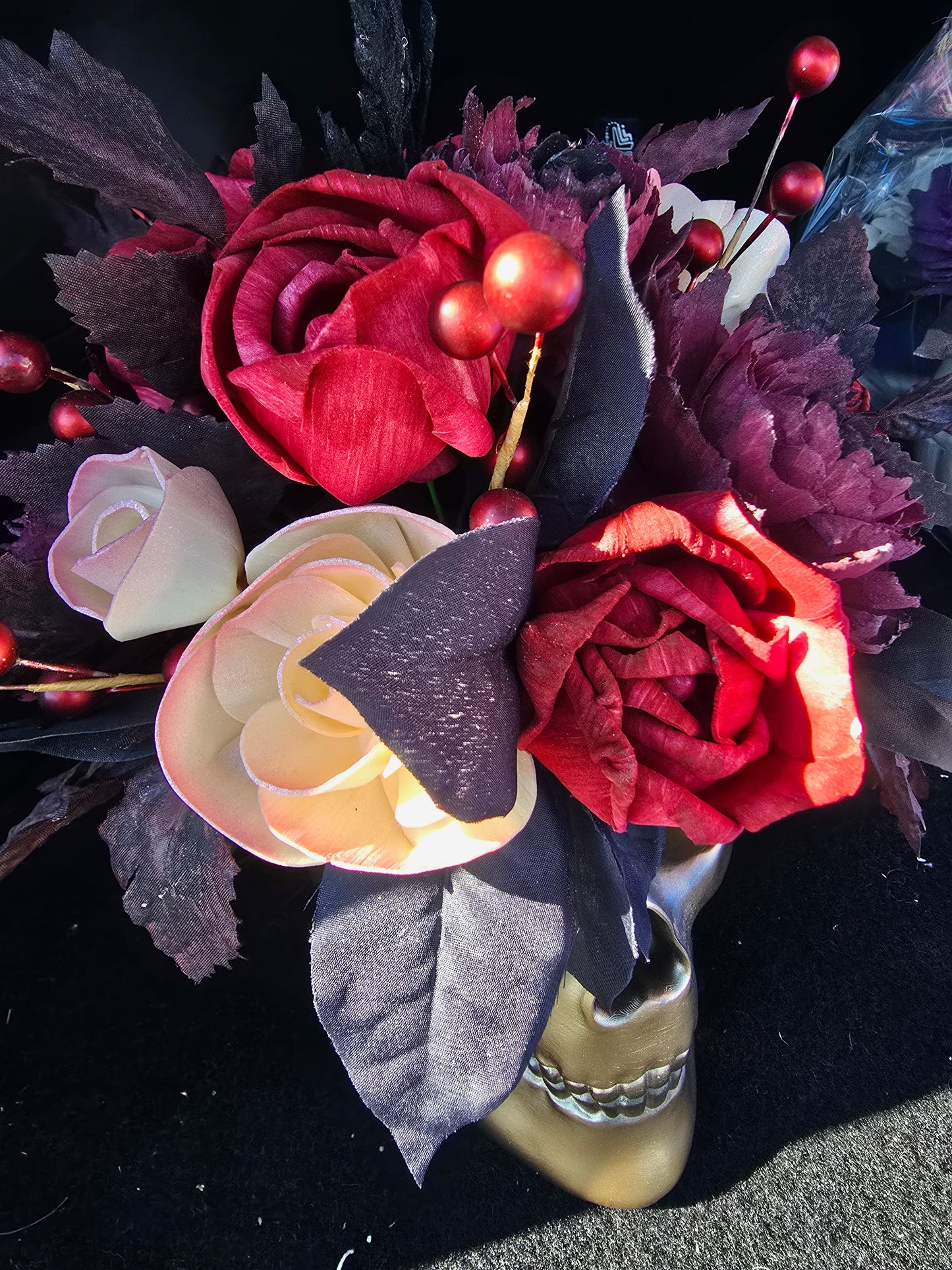 Gold Skull with Red, Black, and Champagne Roses